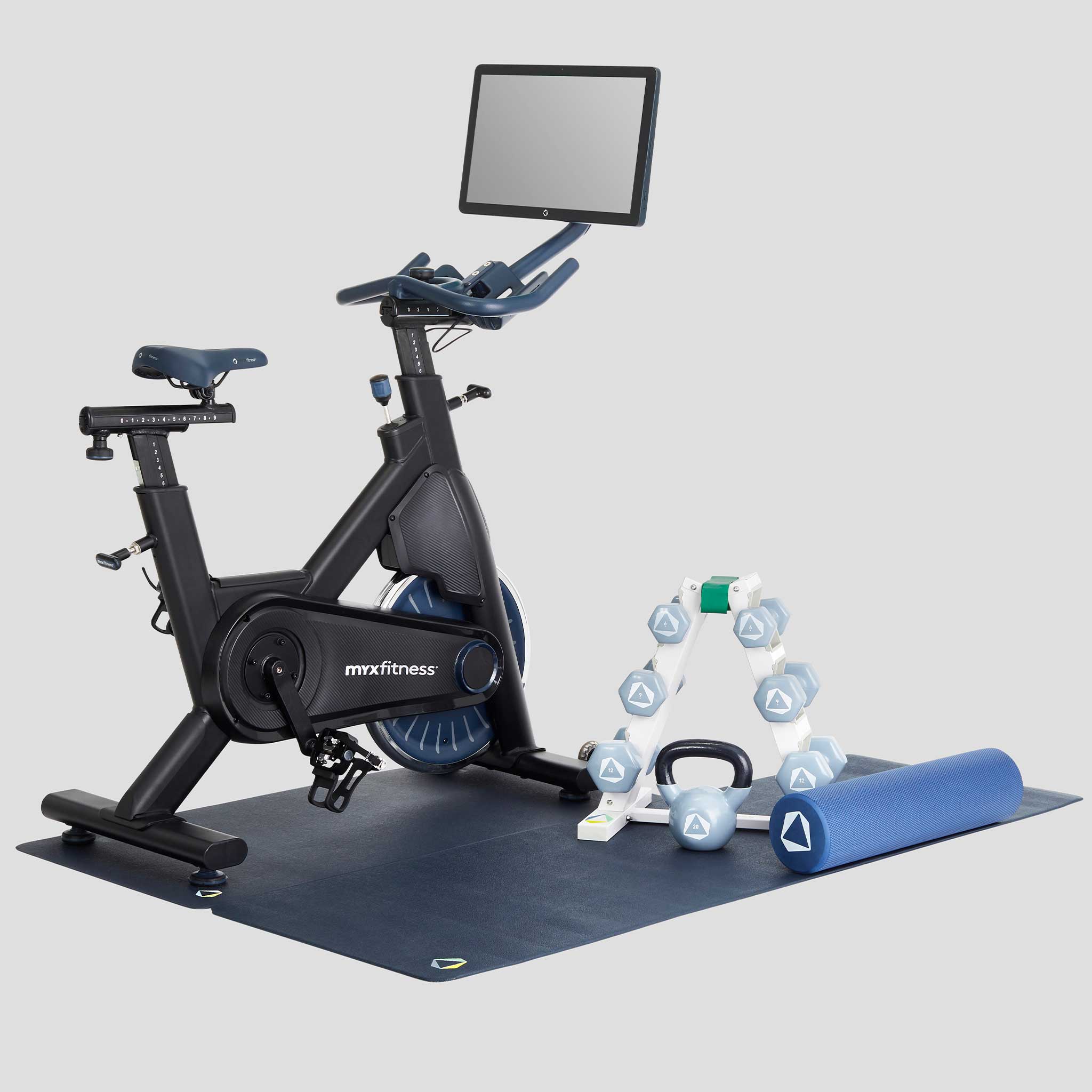 The BODi Bike+ Home Studio in Charcoal black with weight rack, foam roller, spri stretch band, kettlebell and floor mats